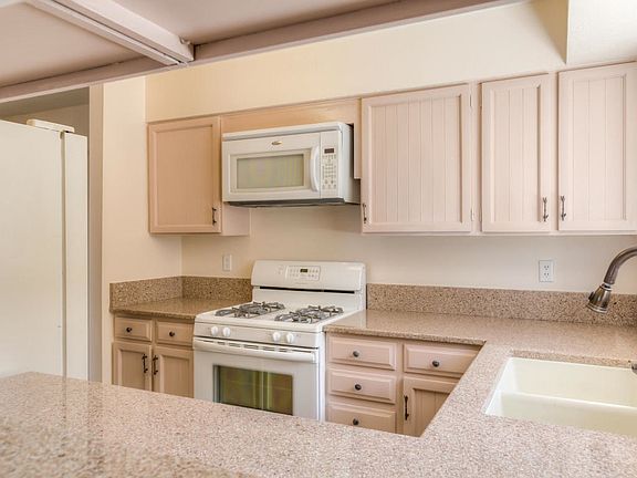 light and bright kitchen with new quartz counters