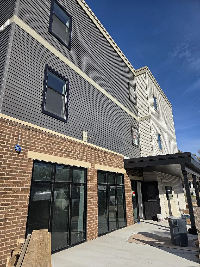 Office entrance from the parking lot. - Lofts at Lumber Square