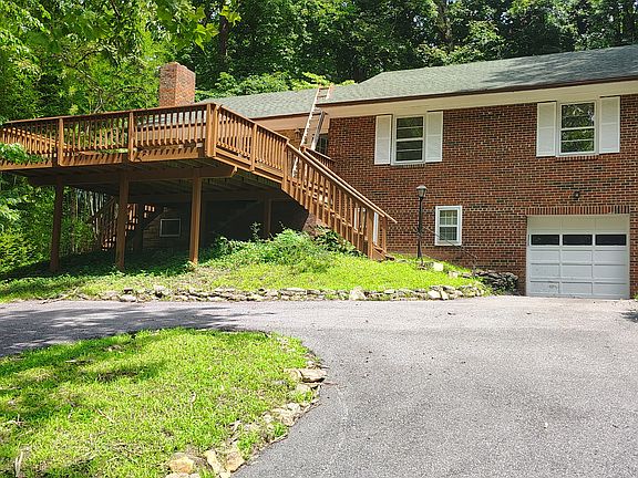 View from driveway connecting Orkney Pkwy to the house with its large front deck and serene views overlooking the neighborhood
