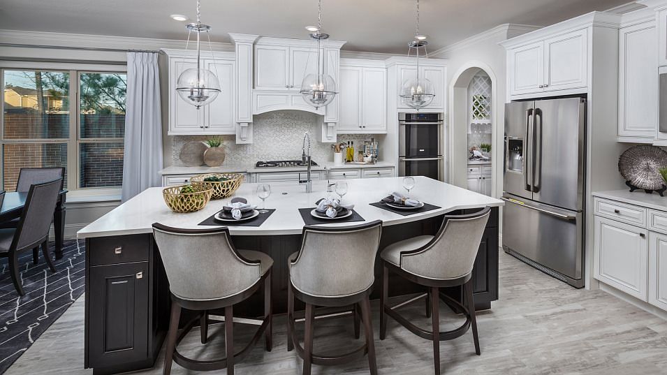 The modern kitchen is ready for culinary adventures with new stainless-steel appliances, designer ca