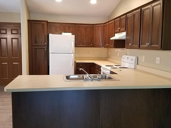 Open floor plan, lots of cabinets, closet and entry from two stall garage.