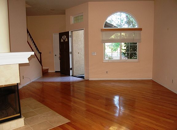 Living room with fireplace and wood floors
