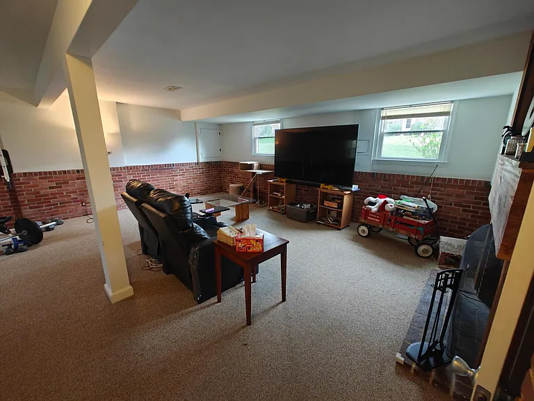 Large family room. For scale, the TV is 85".