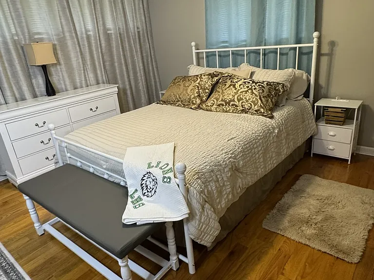 Second bedroom has queen-size bed with blackout curtains