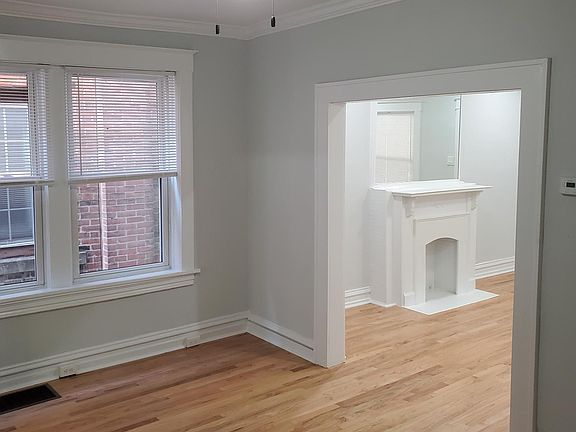 Partial view of middle room, new replacement windows, hardwood, new ceiling fan, 2 closets in this room, one large deep close and a 2nd mirrored sliding door.