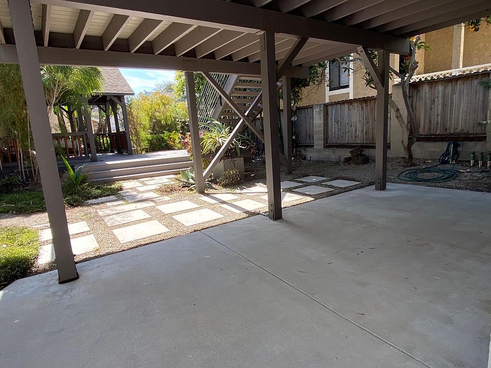 Welcome home! Private patio overlooking garden filled with bamboo and exotic plants.