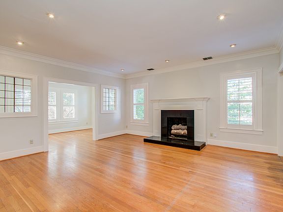 Beautiful fireplace and hardwood floors the office is off of the living room