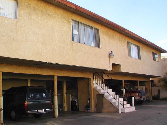 Carport and storage area for 2 units (These units now have brand a brand new roof and fascia boards. They also have newer double-pane and triple pane windows. The hot water heaters are newer as well. )