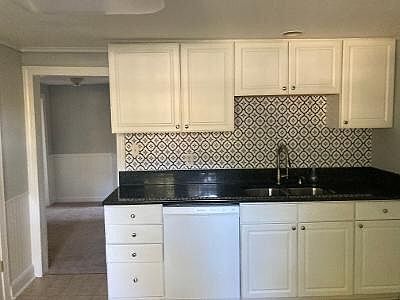 Eat in kitchen has new flooring, 2 large windows let in maximum natural light.