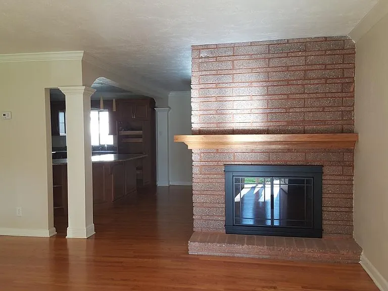View from front door entry to living room and kitchen