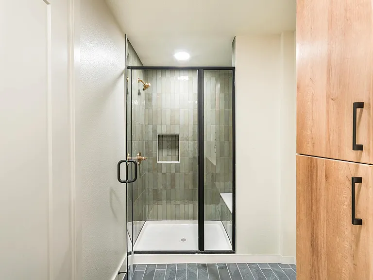 Frameless glass showers and serene design make this bathroom the perfect place to relax at the end of the day.