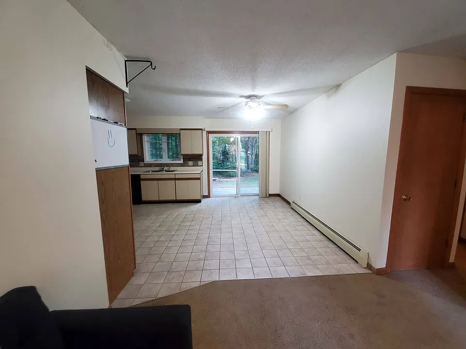 Large open-concept living space 
Tile kitchen area that opens to the back yard