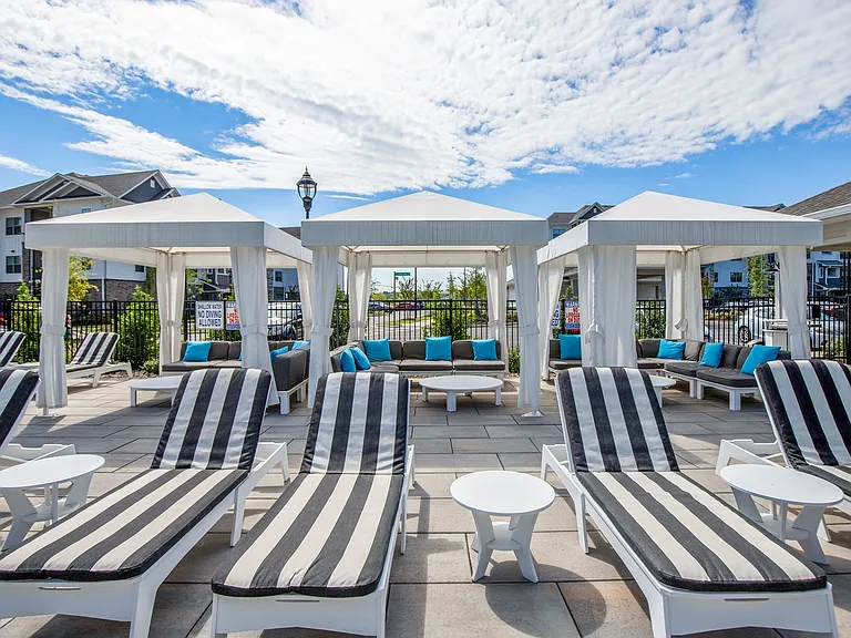 Expansive Pool Area with Cabanas