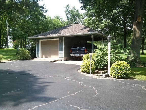 Detached garage with carport
