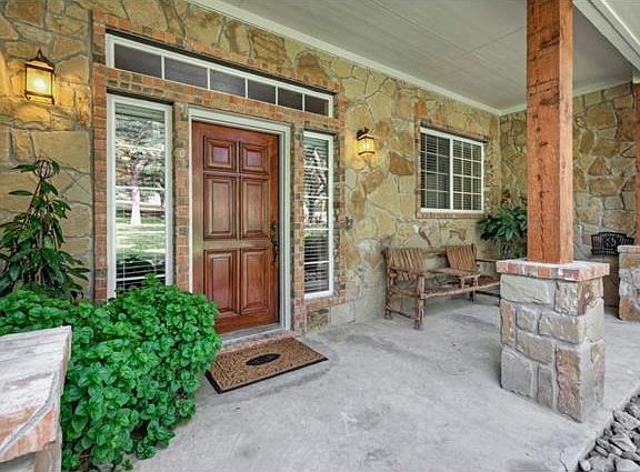 Enjoy morning coffee watching the deer graze on your West facing covered front porch.