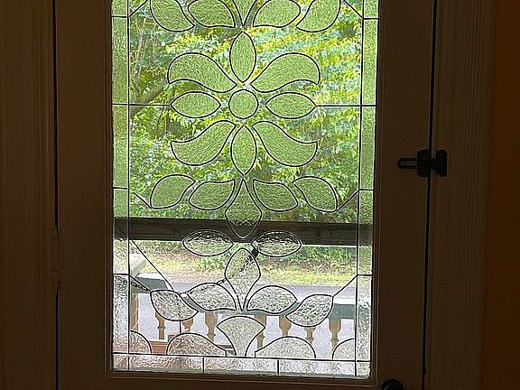 Front door w stained glass.