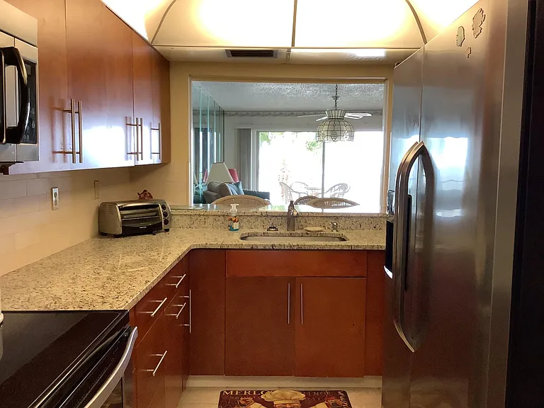 Kitchen with view of the Gulf; side by side fridge with filtered ice and water in the door