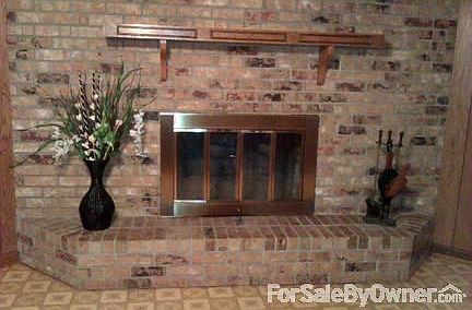 Den with Brick Fireplace