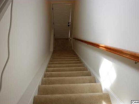 carpeted stairs at entryway.