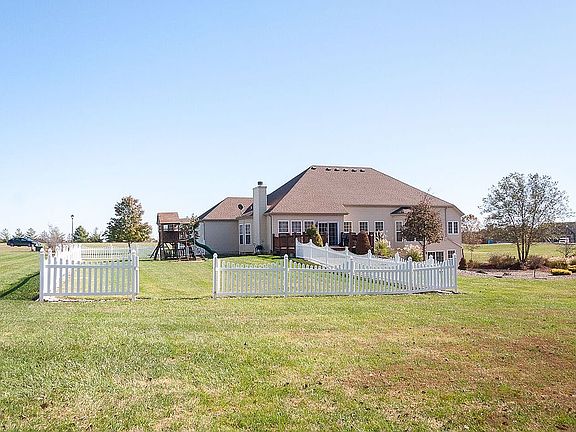 Partially fenced back yard.
