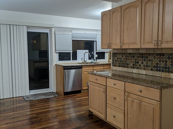 Additional cabinets for ample storage. Granite countertops, slate backsplash