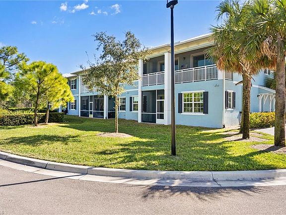 Private covered, screened lanai space with view of greenspace.