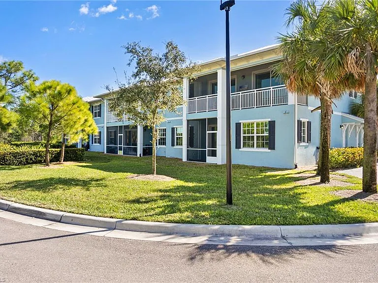 Private covered, screened lanai space with view of greenspace.
