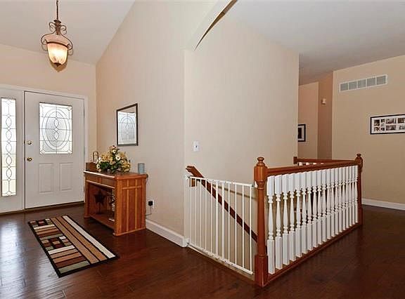 Entry way with gleaming wood floors