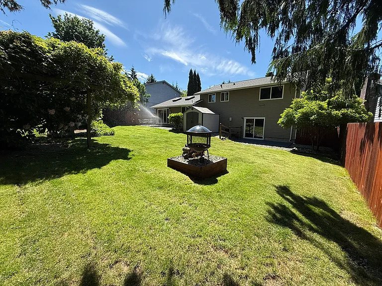 View of the house from the NW corner of the backyard.
