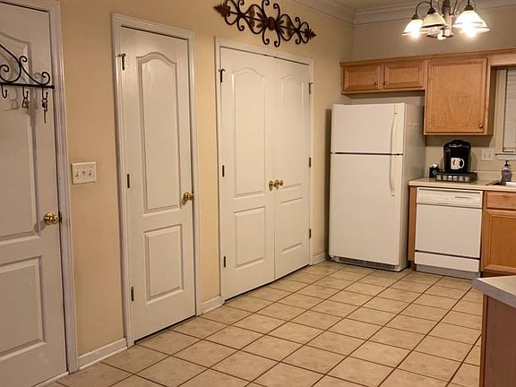 The kitchen is next to the dining room & great room