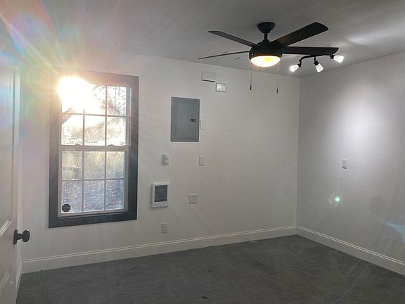 Big bedroom with walk-in closet adjacent to living/kitchen area.