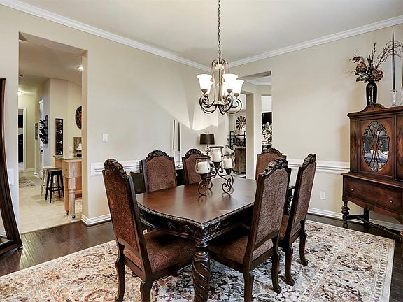 Enter this amazing home and find the formal dining room with high ceilings, wood flooring and well appointed crown moldings.