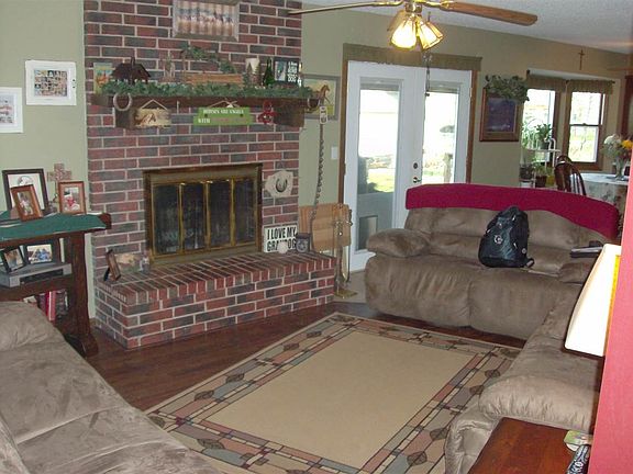 lr area view w/wood burning fp,  doors to back deck