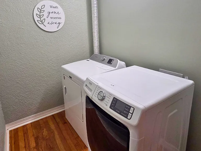 Laundry space equipped with washer and dryer.