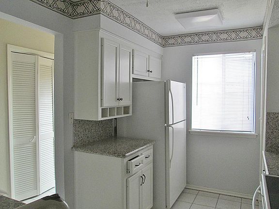 Other Side of the Kitchen. Pantry is to the right of the Window Area. Fridge Stays! All the Lighting
