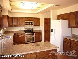 Kitchen with granite and brick floors