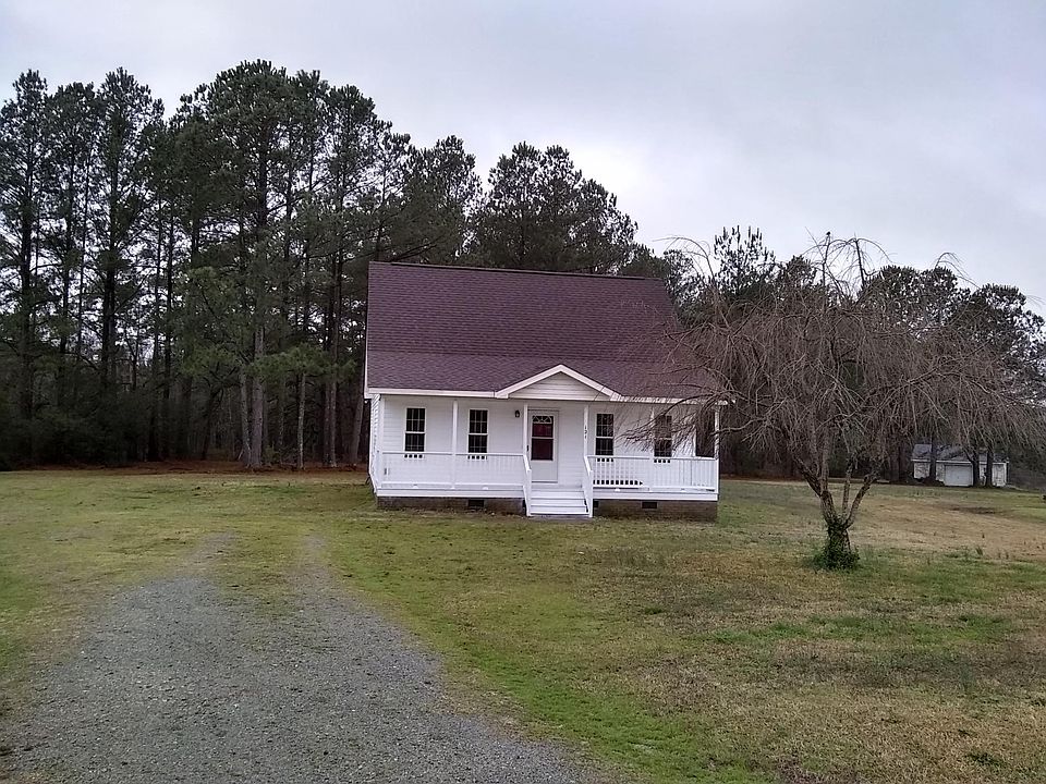 House situated on 1.26 acres with pond in the back