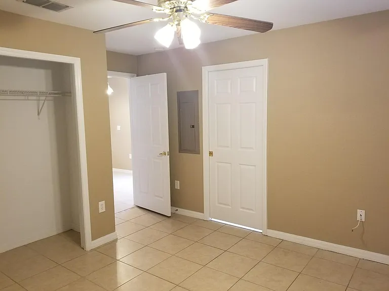 1st floor bedroom. The open door on the left leads to the Kitchen; on the right leads to the 1st floor bathroom.