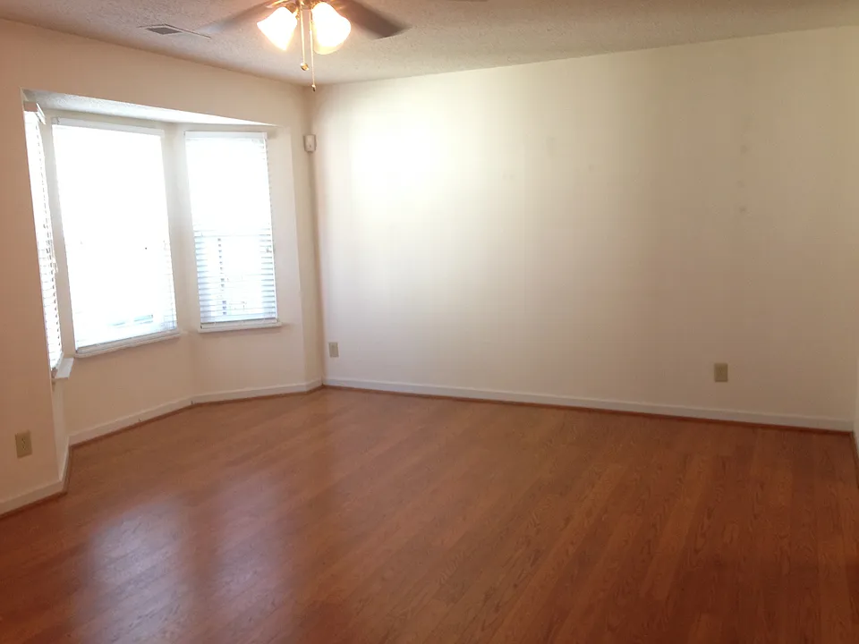 Large living room with wood floors