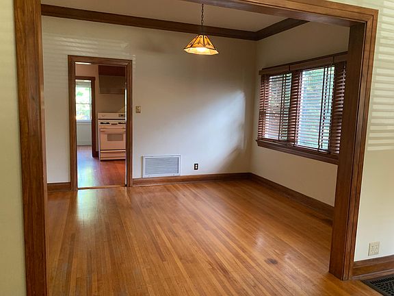 From the living room looking into the dining room to the kitchen