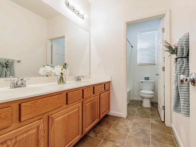 2nd bathroom upstairs. 2 sinks, tub, shower and toilet.