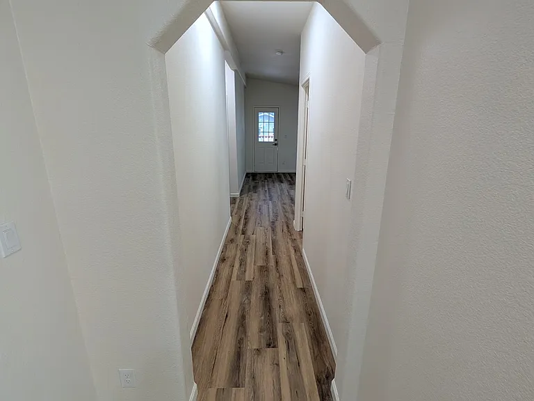 Hallway to Family Room and other Bedrooms