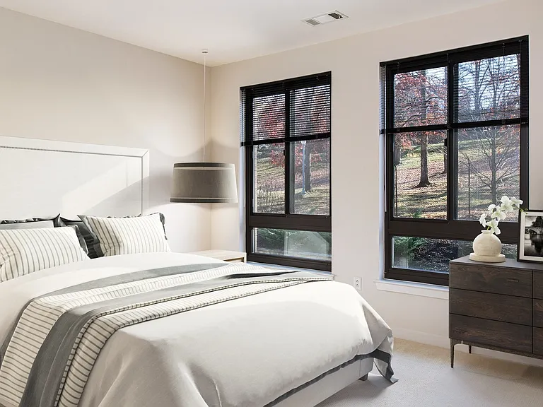 Spacious bedrooms with large windows providing ample natural light