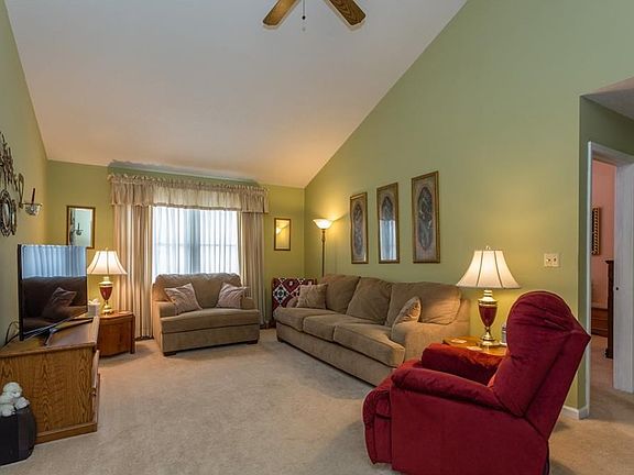 Large comfortable great room with cathedral ceiling and lots of natural light