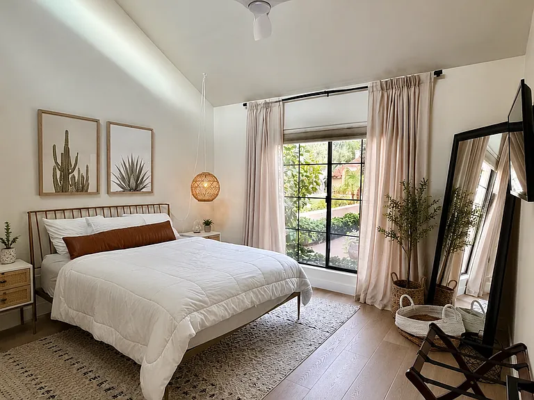 Secondary guest bedroom with storage closet and drawers