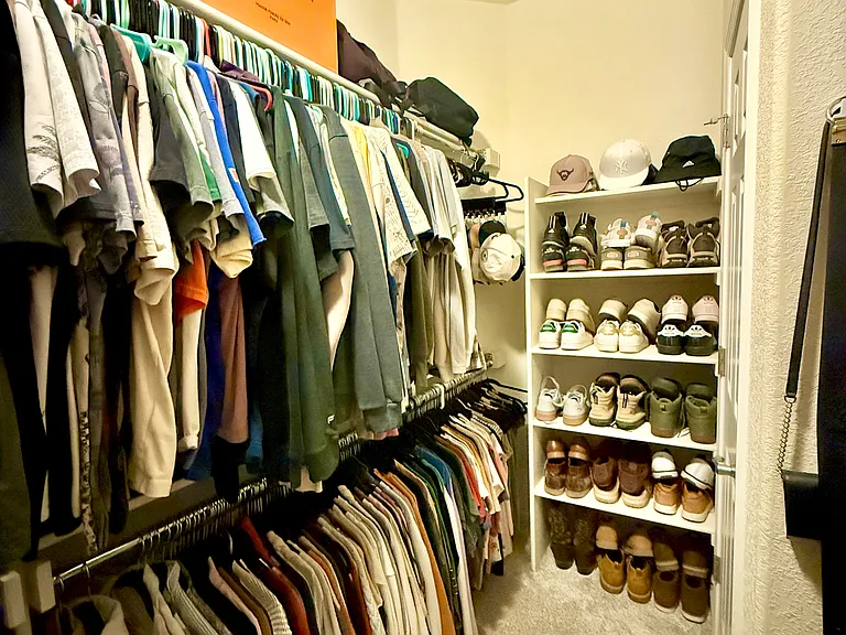 Primary bedroom walk-in closet