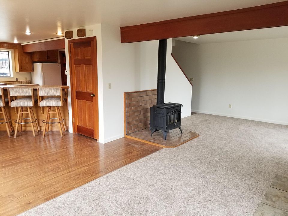 front room with gas stove and access to dining and kitchen