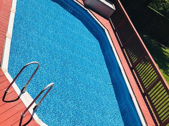 Swimming pool in back yard