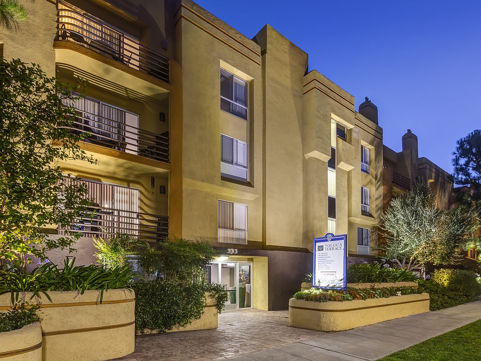 Apartments in Burbank, CA - Night Time Exterior Community Entrance Sign Lit Up