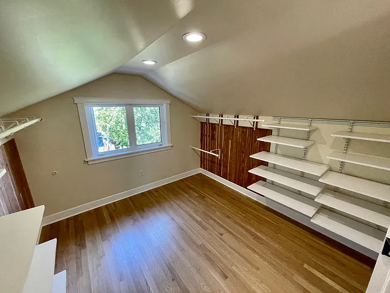Huge walk-in closet with cedar-lined walls, overlooks back yard with peek-a-boo view of the Olympic Mountains